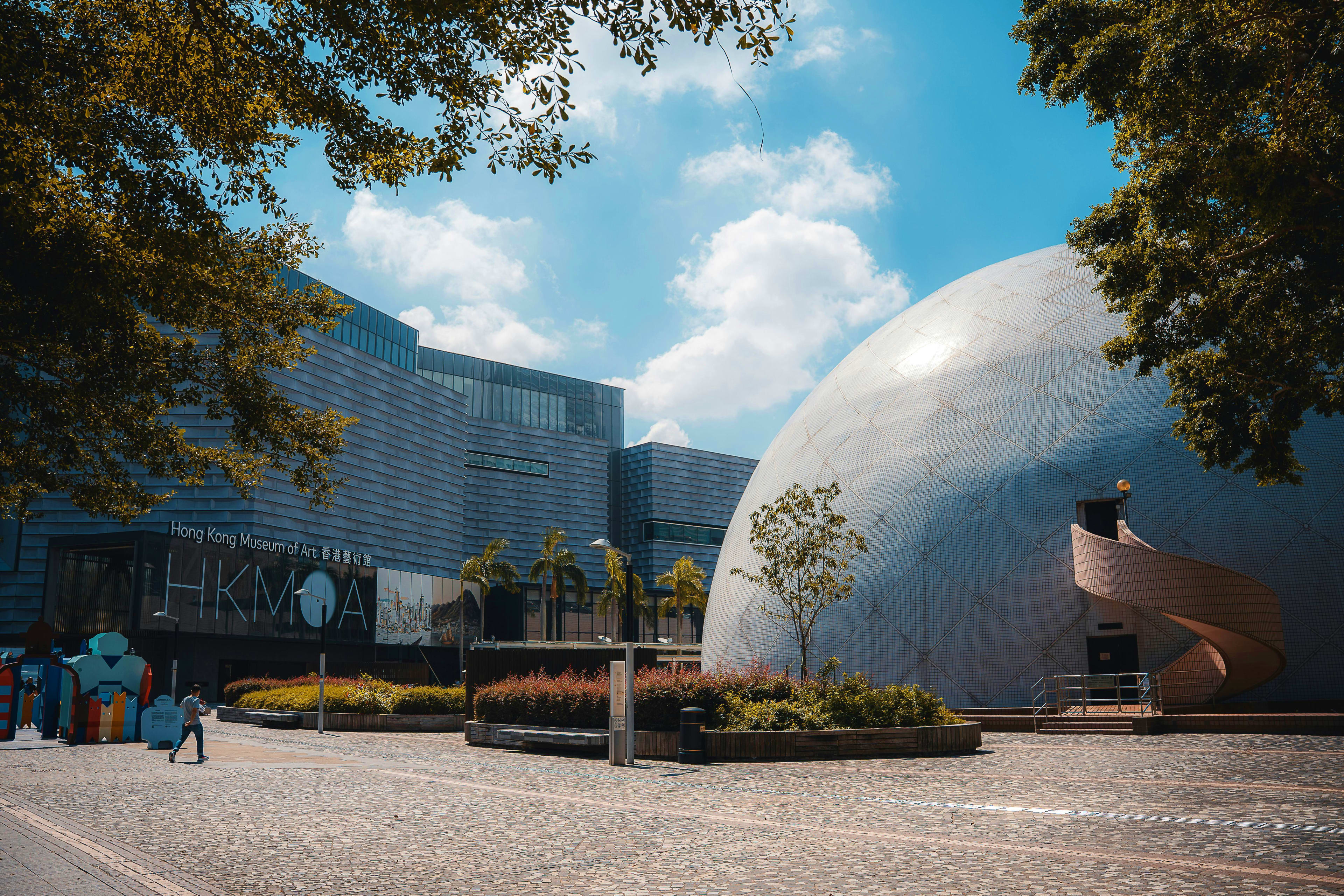 Hong Kong Museum of Art exterior with modern architecture featuring a white spherical dome structure and rectangular building